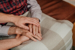 Two people holding hands