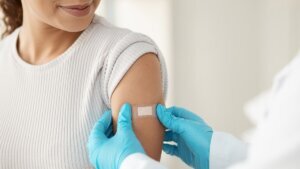 Vaccine,,Happy,Woman,And,Hands,Of,Doctor,With,Plaster,For