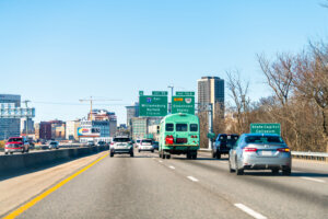 Interstate highway road 95 traffic with cars and Richmond, Virginia cityscape skyline