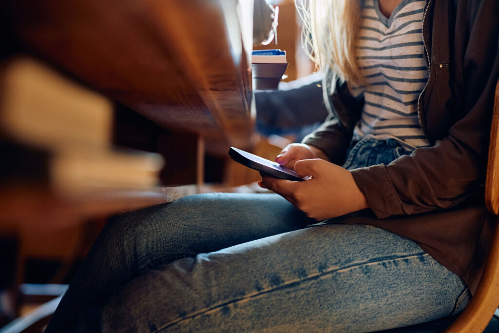 High school student texting on cellphone