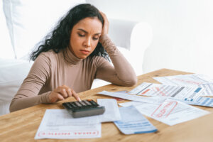 Stressed young woman has financial problems credit card debt to pay crucial