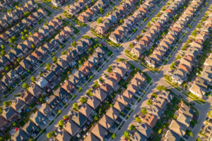 Aerial view of middle class residential houses at summer evening