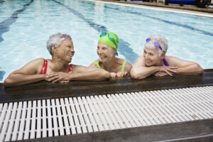Smiling senior women in a pool