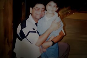 Surinder "Paul" Sharma with one of his children.
