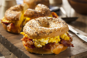 Hearty breakfast sandwich on a bagel with egg, bacon and cheese