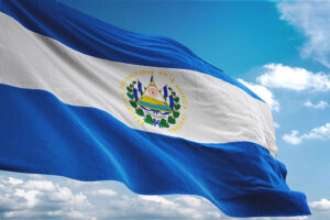 El Salvador flag waving cloudy sky background