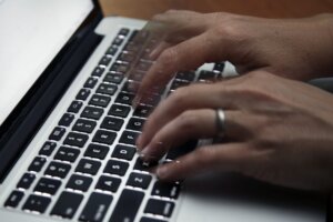 Hands on a keyboard.