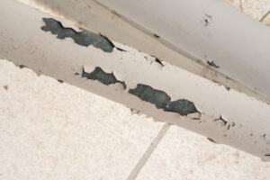 Lead paint chips on pipe