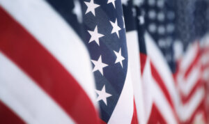 Closeup of an American flag in a row