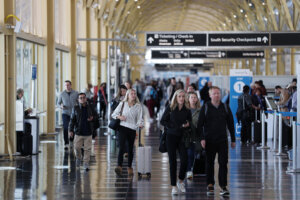 People walk through the Reagan National Airport