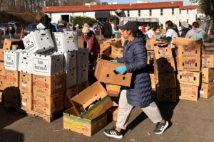 Volunteers with boxes of food
