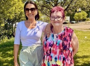 Two women standing side by side