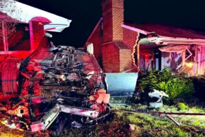 Overturned vehicle after it hit two Southeast DC homes
