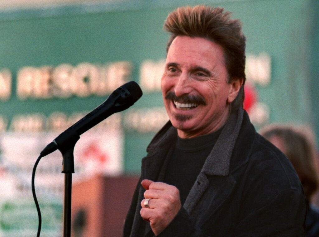 Chuck Negron, former lead singer of Three Dog Night, sings to a crowd during a Christmas Eve party, Dec. 24, 1997, at the Union Rescue Mission in Los Angeles. (AP Photo/John Hayes)

&nbsp;