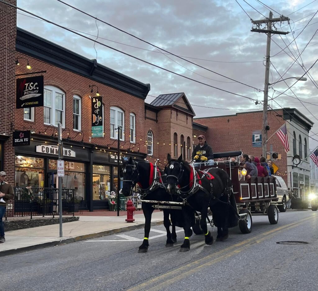 A horse drawn wagon on Main Street in Mount Airy