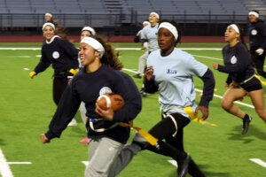 Girls playing flag football