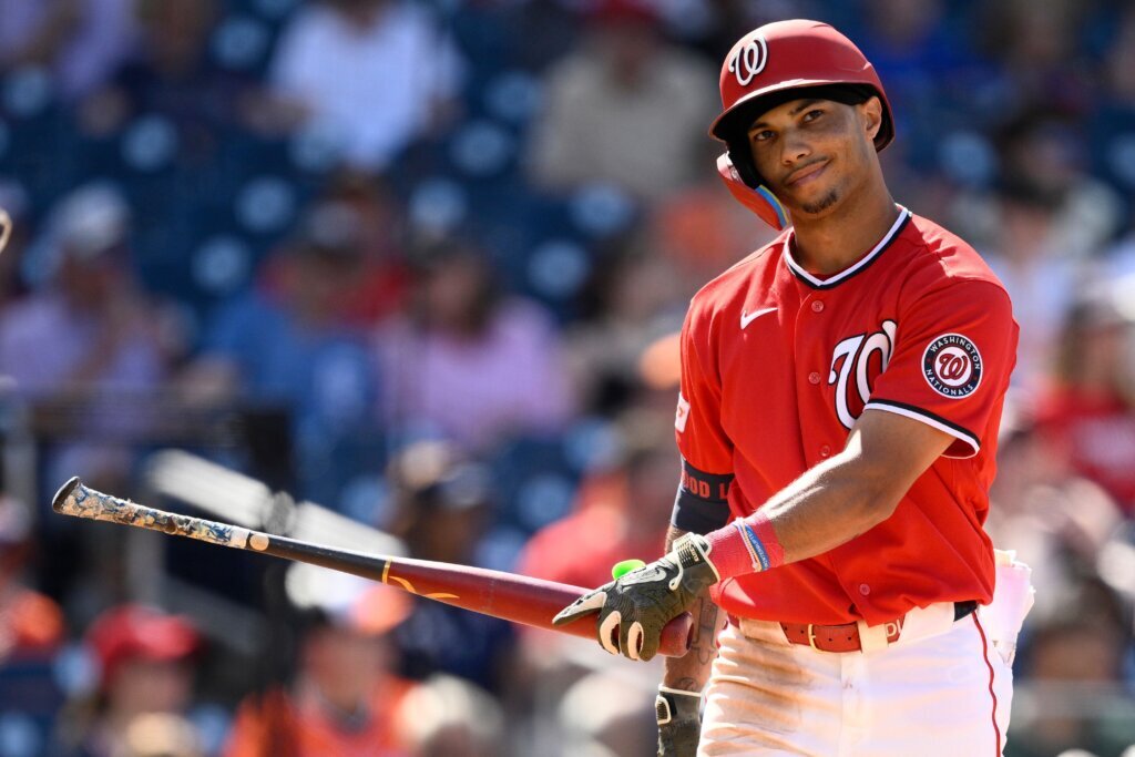Washington Nationals' Daylen Lile reacts after he struck out