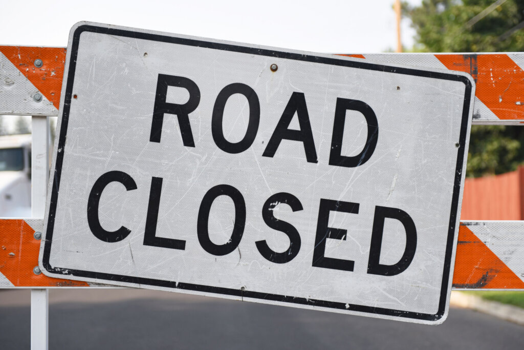 Road closed sign close up