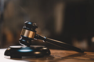 Judgement of judge about legislation, authority, crime, government, justice, punishment, verdict at court decision by gavel. hammer is symbol of judgment and use law.