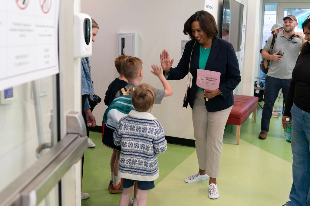 District of Columbia Mayor Muriel Bowser greets supporters as she arrives to cast her vote during the D.C. primary election at Shepherd Elementary, Tuesday, June 16, 2026, in Washington. (AP Photo/Jose Luis Magana)