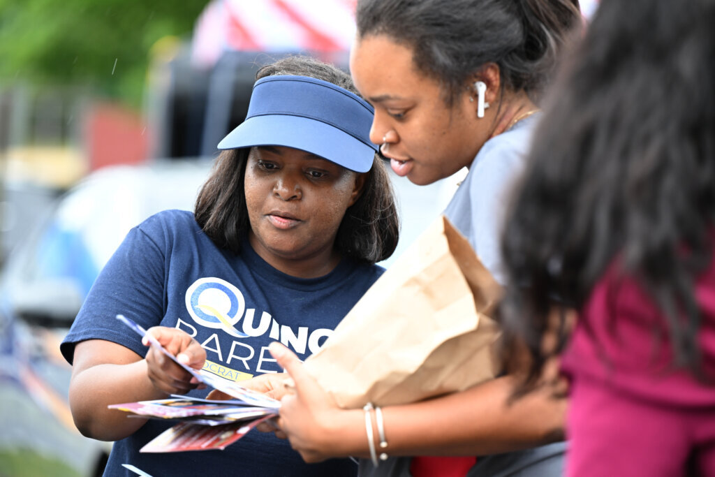 Quincy Bareebe, candidate for Congress, greets voters at the Upper Marlboro Community Center, Tuesday June 23, 2026, in Upper Marlboro, Md. (AP Photo/Gail Burton)