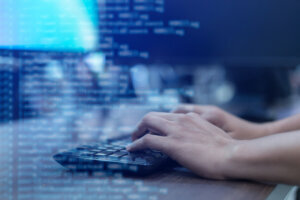 Man typing on a keyboard