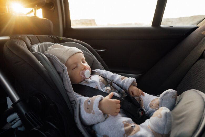 Baby sleeping in an infant car seat