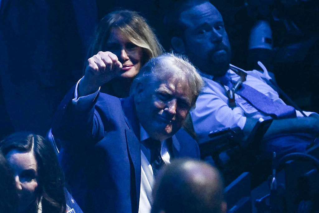 President Donald Trump gestures alongside First Lady Melania Trump as they attend the "UFC Freedom 250" mixed martial arts event on the South Lawn of the White House in Washington, DC, June 14, 2026. (Photo by Kent NISHIMURA / AFP via Getty Images)