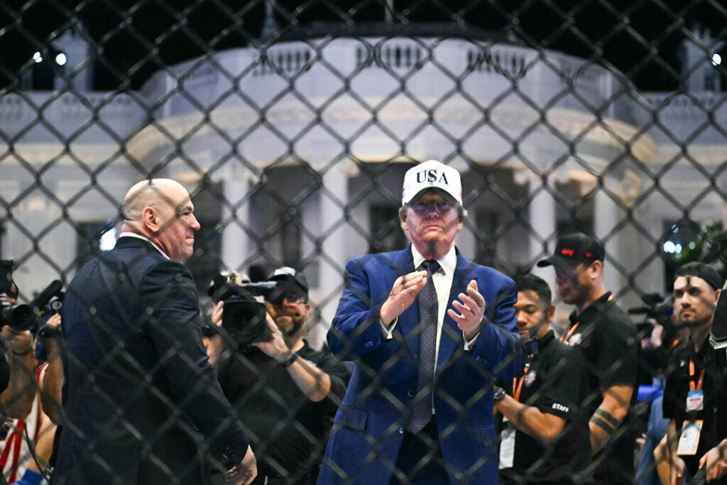 U.S. President Donald Trump stands in The Octagon with UFC CEO Dana White at the conclusion of the UFC Freedom 250 mixed martial arts event on the South Lawn of the White House in Washington, D.C., in the early morning hours of June 15, 2026. (Photo by Kent NISHIMURA / AFP via Getty Images)