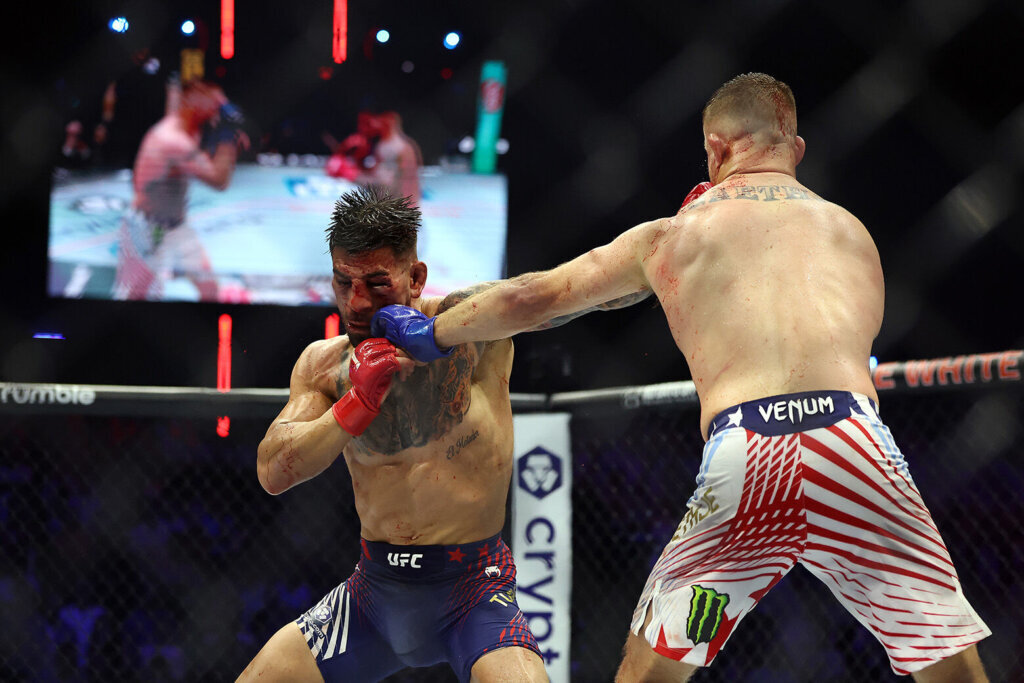 Ilia Topuria of Georgia and Justin Gaethje of the United States exchange punches in the UFC Lightweight Championship bout during UFC Freedom 250 at the White House on June 14, 2026, in Washington, DC. (Photo by Chris Graythen/Getty Images)