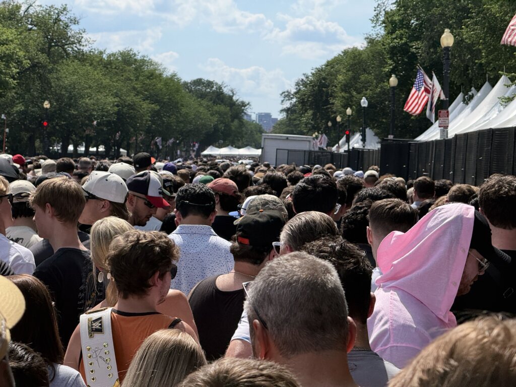 Fans line up for the "UFC Freedom 250 Fan Fest" at the Ellipse on Saturday afternoon. (WTOP/Jimmy Alexander)