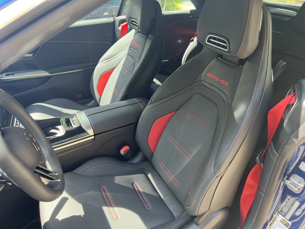Inside, there’s a black leather interior with red accents and red seat belts. Seats are heated and cooled and feature a massage function. (WTOP/John Aaron)