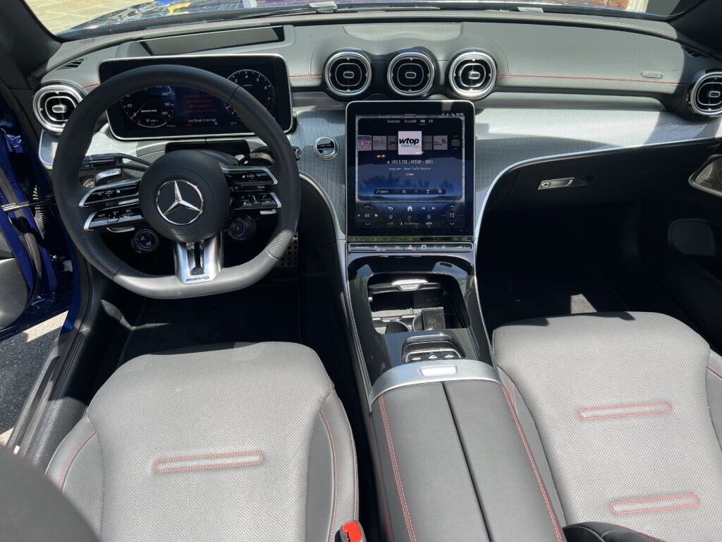 Back to the dazzle: the central screen can be electrically tilted “to prevent reflections caused by sunlight when the soft top is open.” (WTOP/John Aaron)