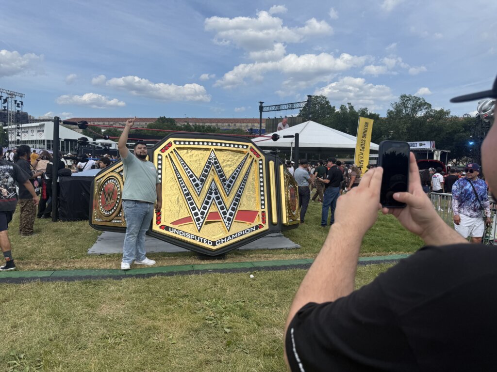 A replica of a WWE belt is featured on the National Mall. (WTOP/Jimmy Alexander)