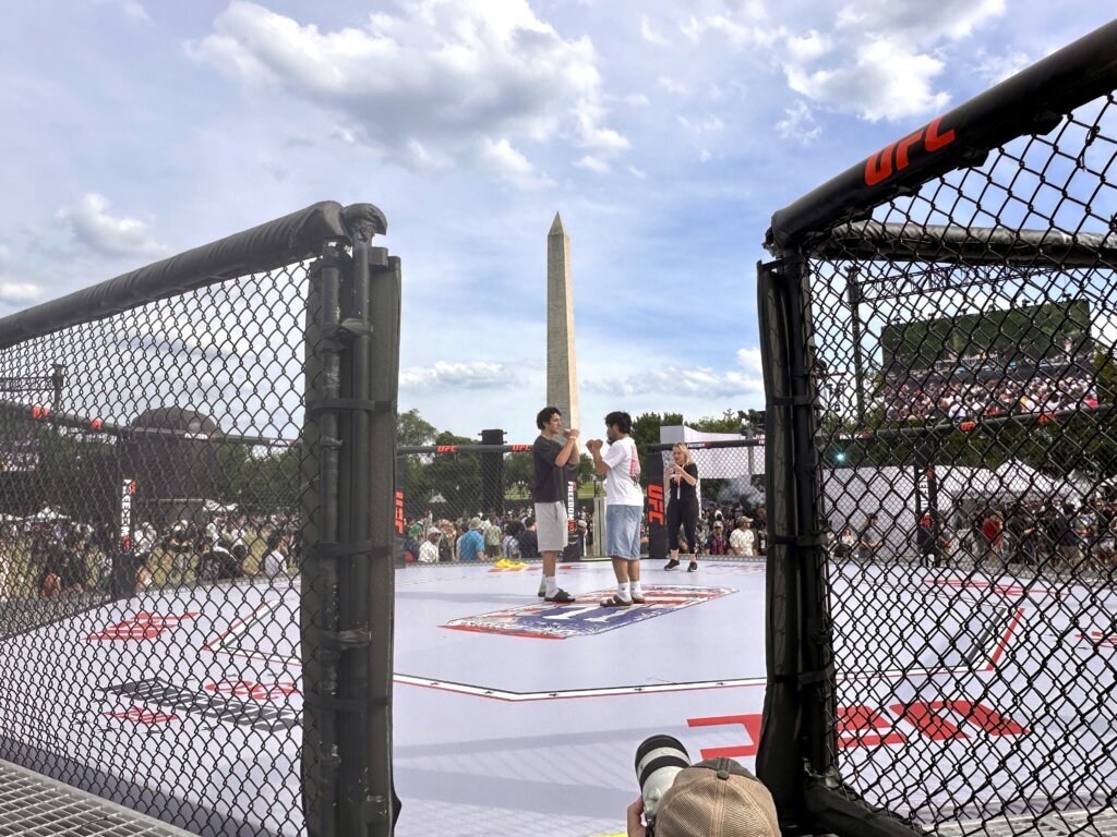 Two people are squaring up inside the UFC cage. (WTOP/Jimmy Alexander)
