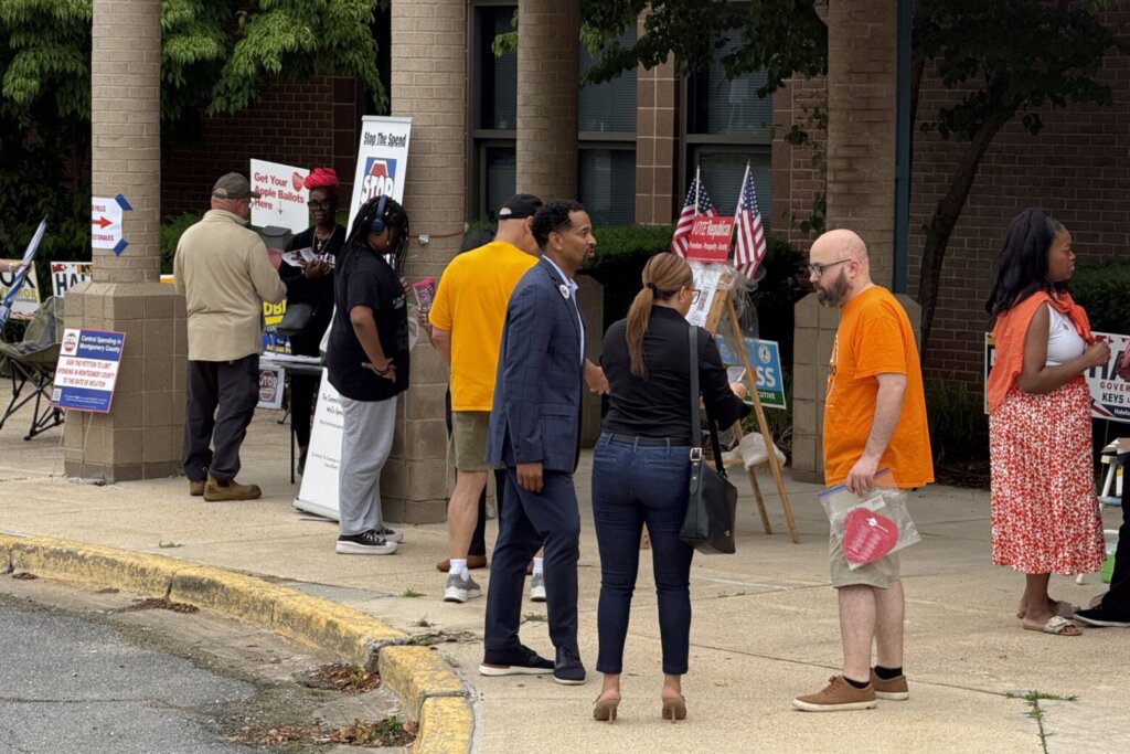 Will Jawando greets voters near a polling place on primary election day in Maryland on Tuesday, June 23, 2026.