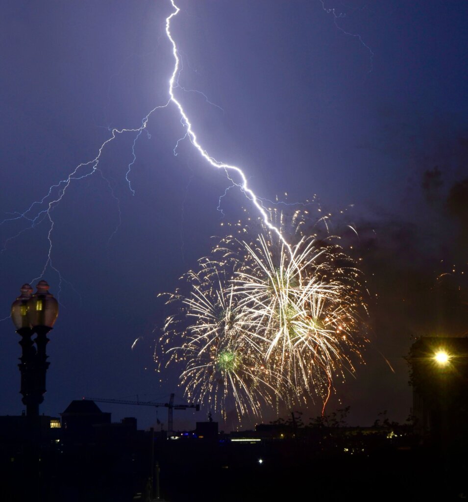 Lightning struck while fireworks burst in the skies of the D.C. region. (WTOP/Dave Dildine)