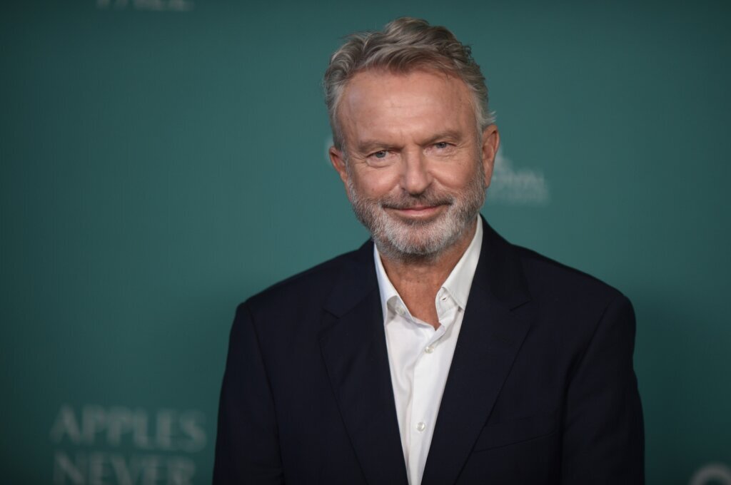 FILE - Sam Neill arrives at the premiere of "Apples Never Fall" on March 12, 2024, in Los Angeles. The "Jurassic Park" actor died in July 2026. He was 78. (Photo by Richard Shotwell/Invision/AP, File)
