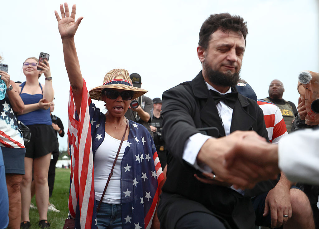 Visitors refuse to leave the grounds of the "Salute to America 250" Fourth of July celebrations after officials instructed everyone to evacuate the area due to severe weather on the National Mall on July 04, 2026 in Washington, D.C. (Photo by Finn Gomez/Getty Images)