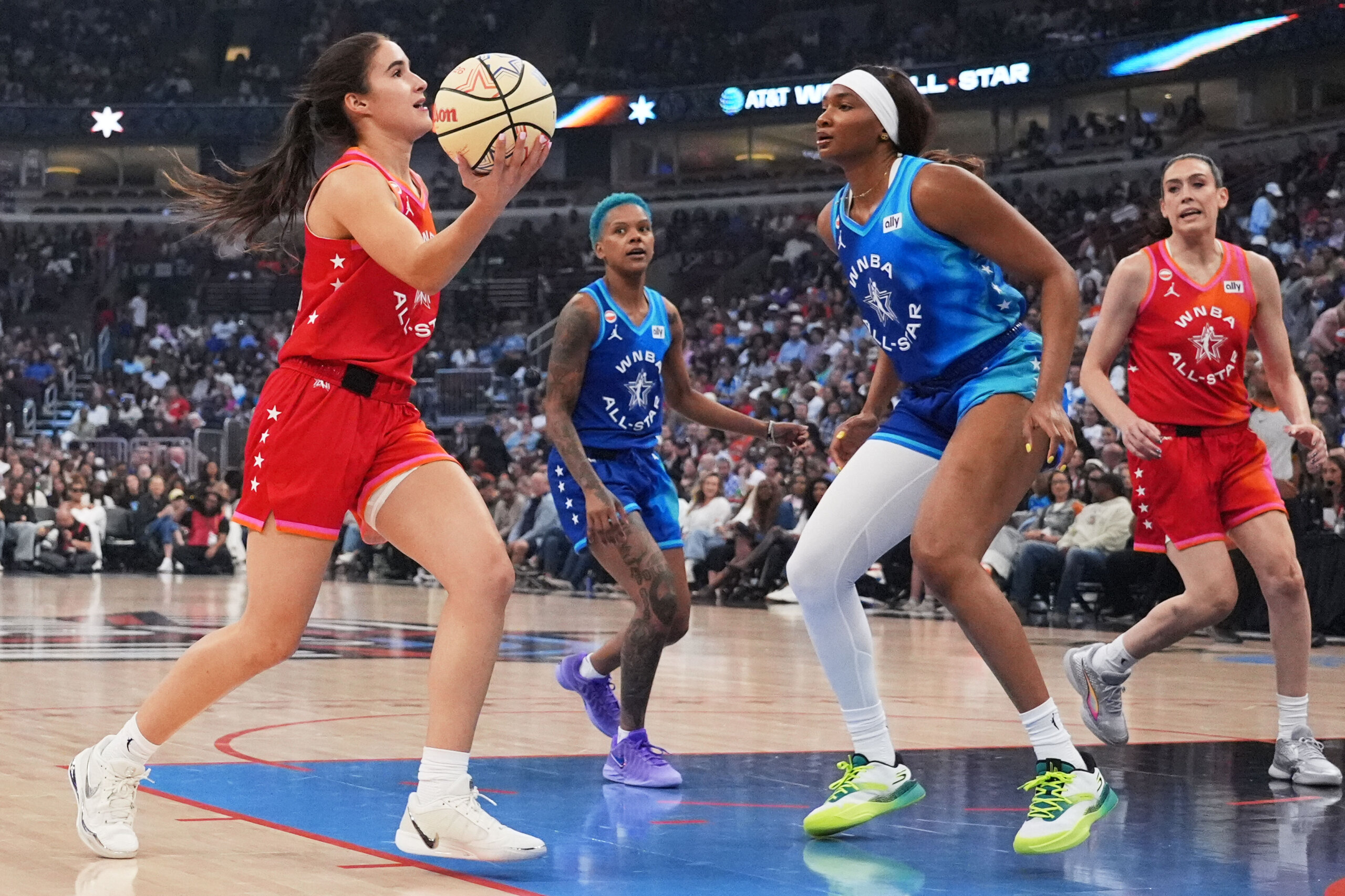 Team Coop's Sonia Citron, left, drives to the basket against Team Spoon's Kiki Iriafen