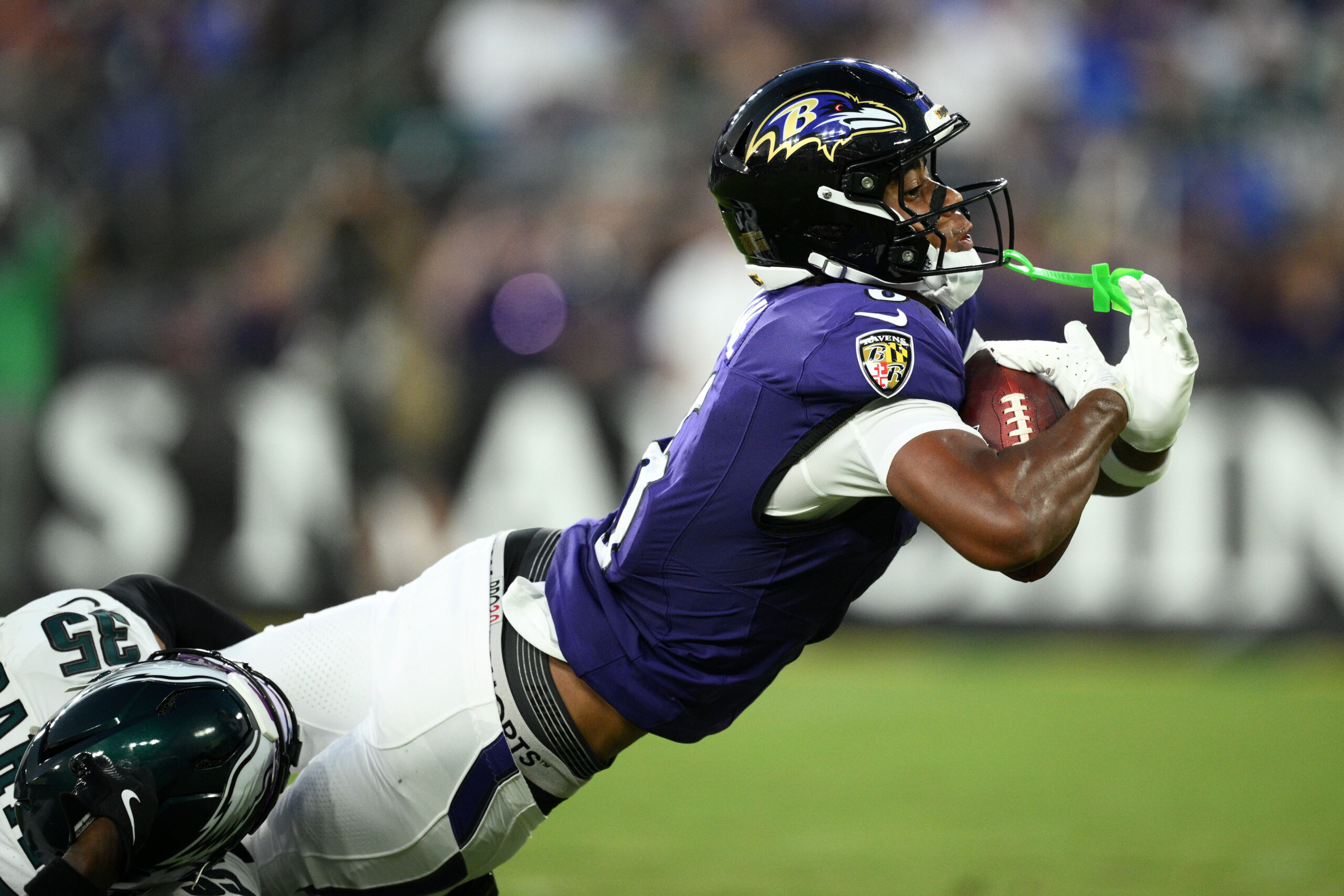 Baltimore Ravens wide receiver Ja'Kobi Lane stretches to score a touchdown