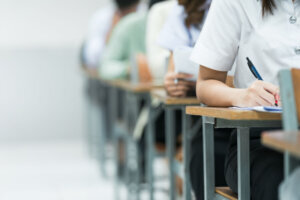 Students taking their exams in a classroom