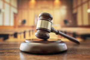 Judges gavel in courtroom legal trial and law background