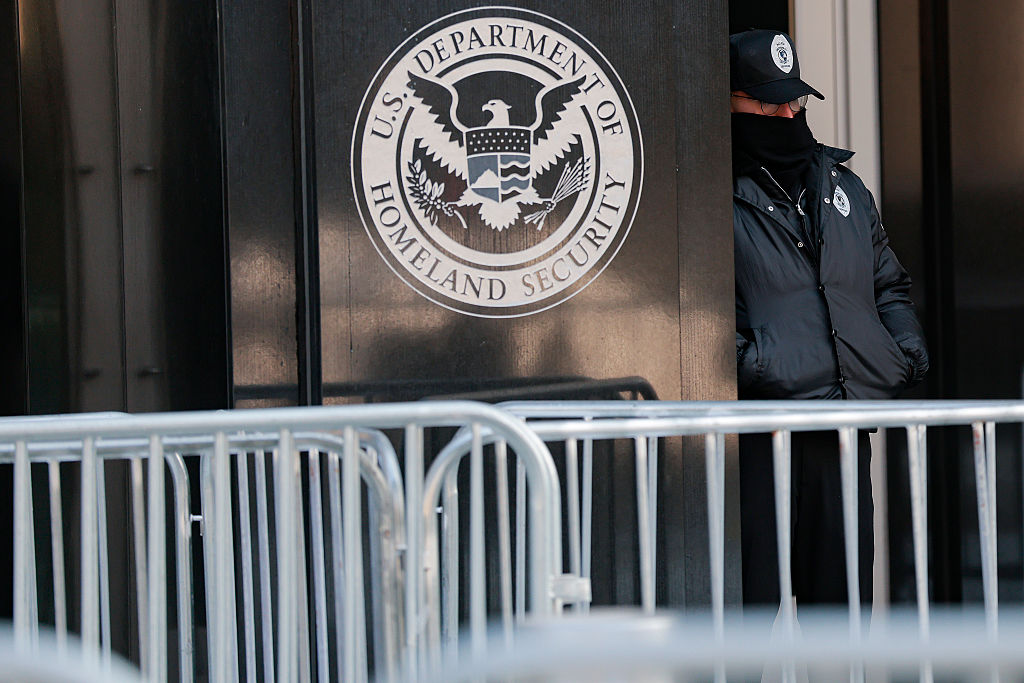 Security stands outside the ICE Headquarters