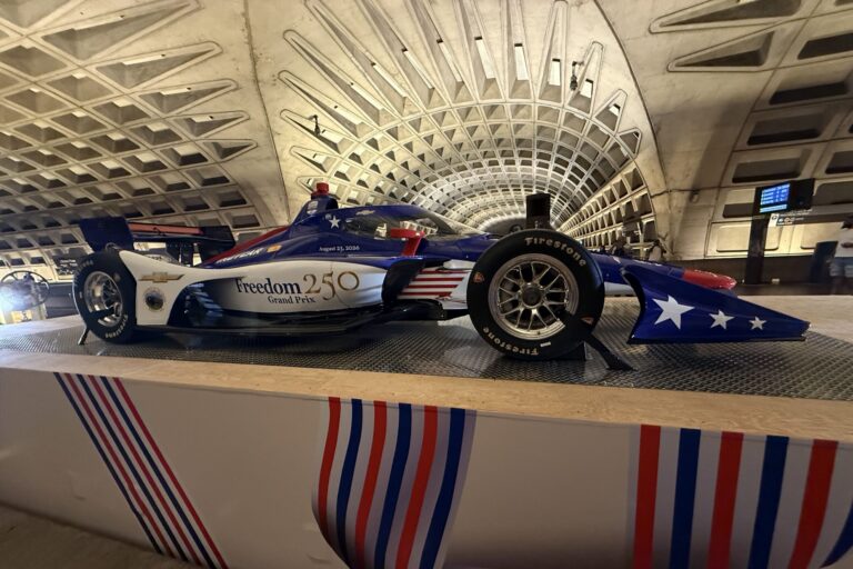 An IndyCar was pulled along the Metro tracks