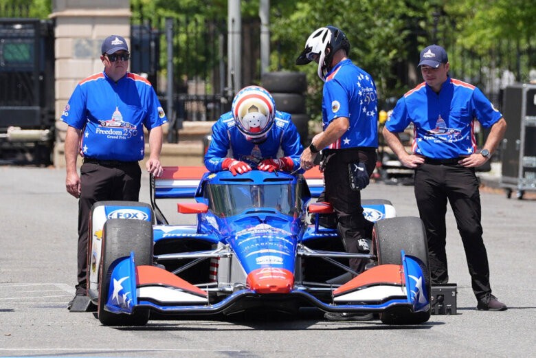 IndyCar Series driver David Malukas boards a race car
